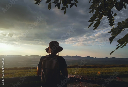 Young man traveler backpacker looking view beautiful nature landscape