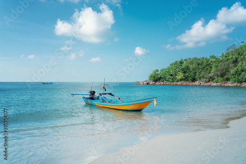 Beautiful tropical landscape, white sand, blue sea and traditional Thai boat, travel to Southeast Asia to Thailand to the islands, sea tours and travel