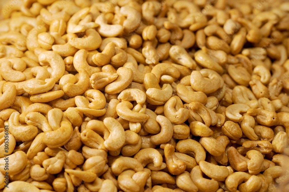 Close up pile of Roasted cashew nuts texture and background