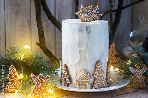 Homemade honey cake with sour cream, decorated with gingerbread. Rustic style. photo