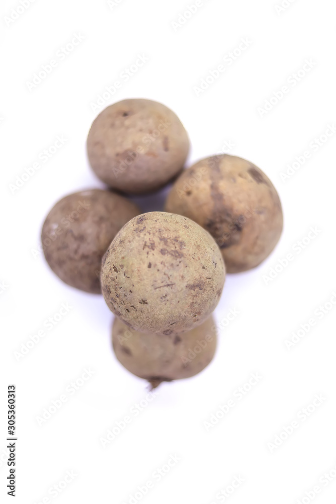 Sawo fruit commonly known as sapodilla sapota fruit isolated on white with copy space Sawo fruit commonly known as sapodilla sapota fruit isolated on white with copy space