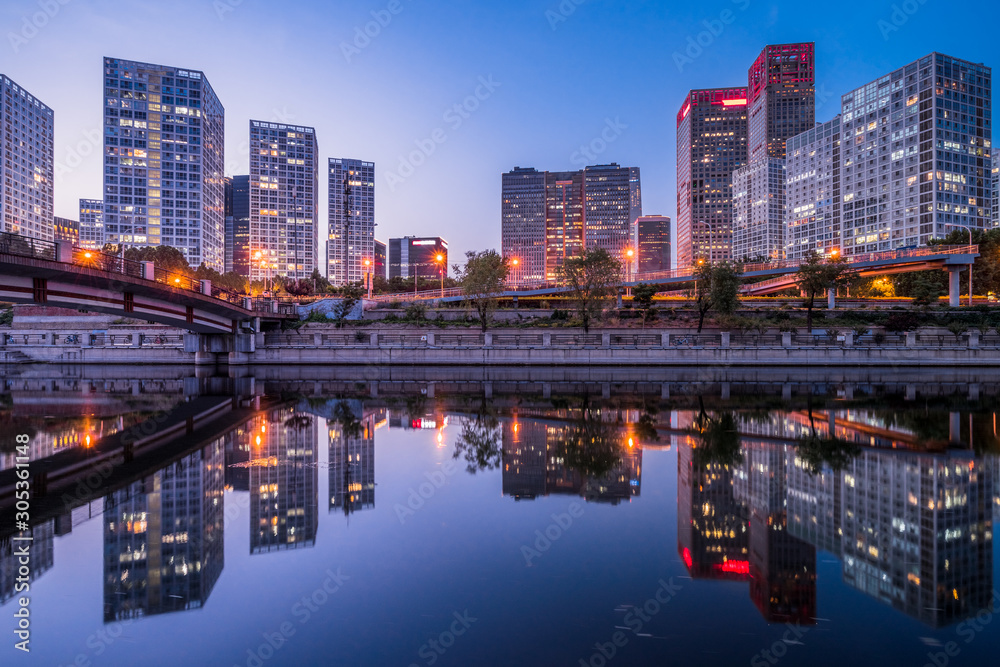 illuminated city waterfront downtown skyline, Beijing, China.