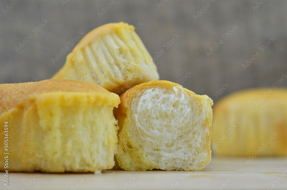 Soft bread open in half on a wooden background