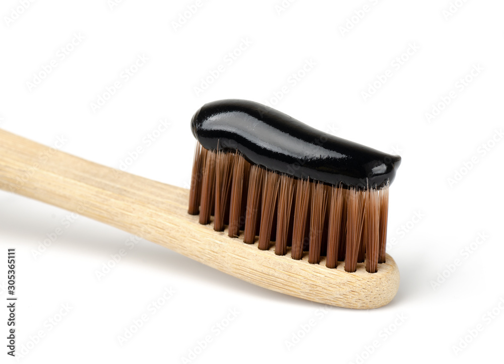 Bamboo toothbrush with black charcoal toothpaste. Bamboo toothbrush with black charcoal toothpaste.