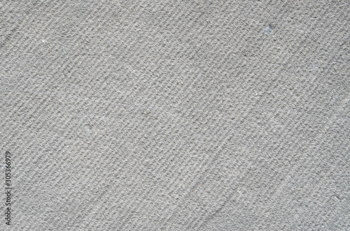 Processed sandstone with parallel lines closeup