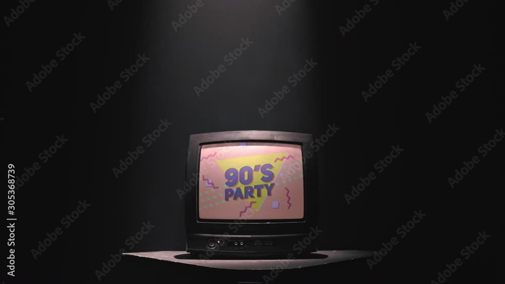 90's party animation on a old vintage TV screen. The light pouring from above on the TV gives the feeling of an approaching miracle. 4K (UHD)