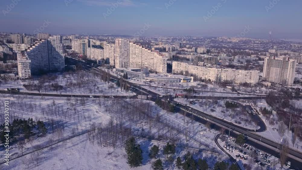 Top view of city in winter at sunset on sky background. Aerial drone videography concept. 4K. Kishinev, Republic of Moldova. Top view of city in winter at sunset on sky background. Aerial drone videography concept. 4K. Kishinev, Republic of Moldova.