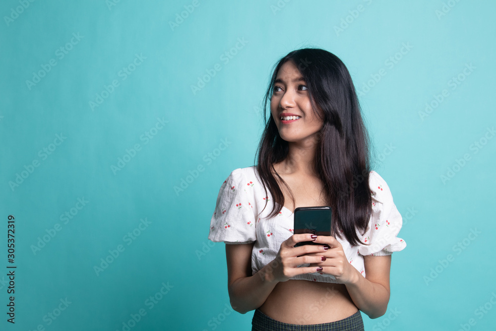 Young Asian woman with mobile phone Young Asian woman with mobile phone