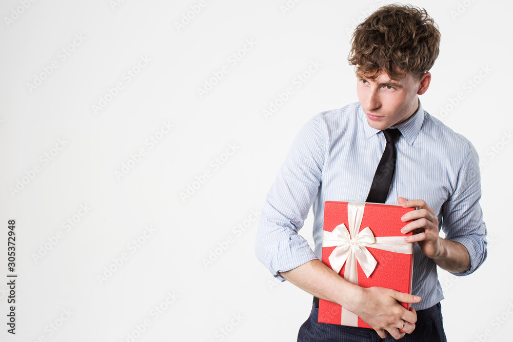 Young man with gifts in hands on a white. Young man with gifts in hands on a white.
