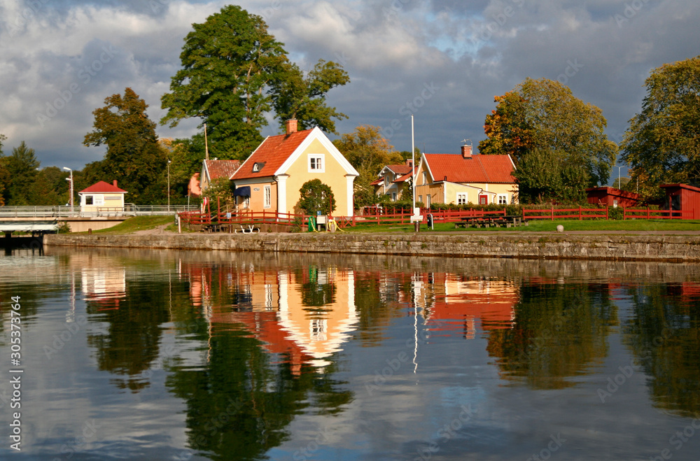 Houses on the Bank of a Lake at Sunset, Sweden