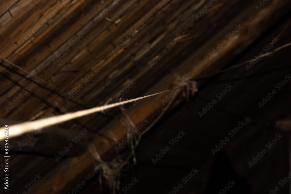 Obraz premium Rope on the roof of old attic