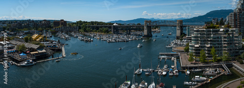 Panoramic view of granville island and  Burrard Street Bridge in Vancouver downtown  Cityscape with blue sky  BC  Canada