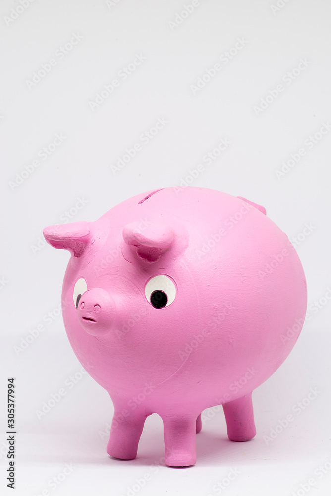ceramic piggy bank or clay shaped like a pink pig