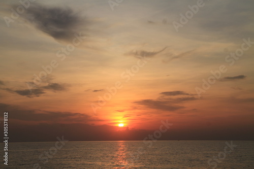 sunset over the sea © Pichit