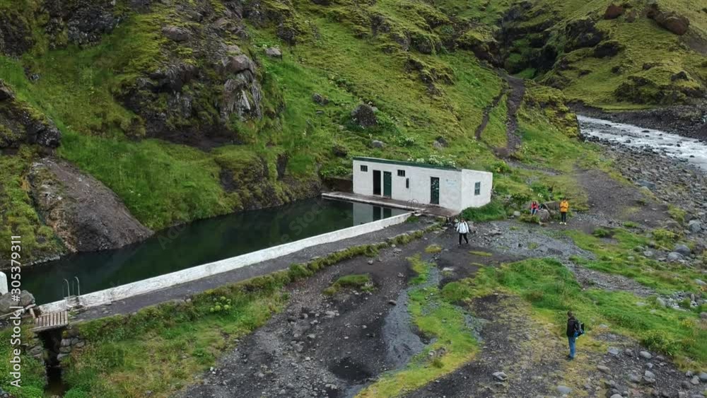 A hot swimming pool in the mountains of Iceland A hot swimming pool in the mountains of Iceland
