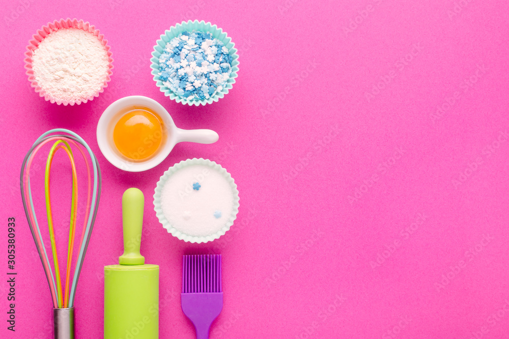 ingredients for baking and kitchen tools on pink background with copy space ingredients for baking and kitchen tools on pink background with copy space