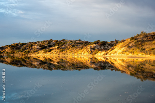 Sunrise reflections on the Onkaparinga River in Port Noarlunga South Australia on 25th November 2019