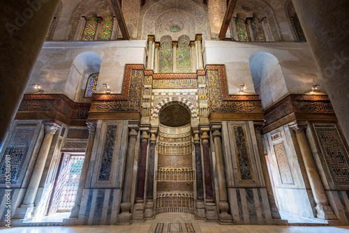 Mausoleum of Sultan Qalawun with decorated colorful marble niche - Mihrab - embedded in decorated marble wall, and colorful stain glass windows, Moez Street, Gamalia District, Medieval Cairo, Egypt photo