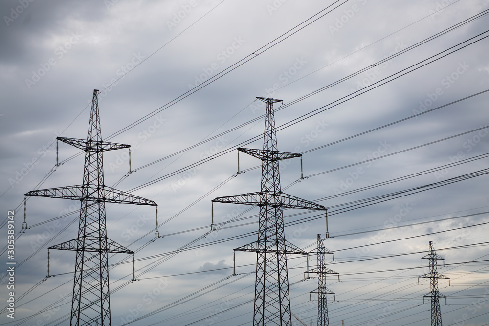 power transmission line in the city with cloudy sky power transmission line in the city with cloudy sky