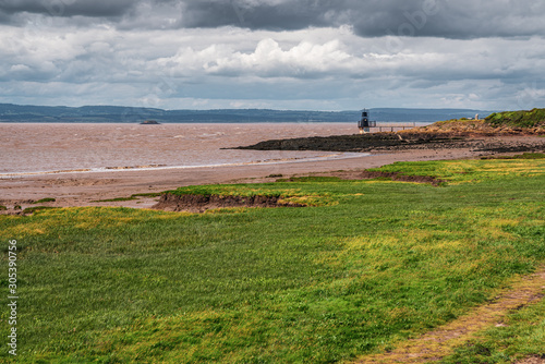 View over Woodhill Bay, the Bristol Channel and the Portishead Point Lighthouse in Portishead, North Somerset, England, UK