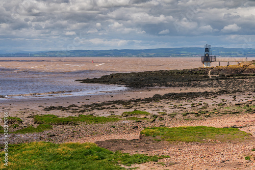 View over Woodhill Bay, the Bristol Channel and the Portishead Point Lighthouse in Portishead, North Somerset, England, UK photo