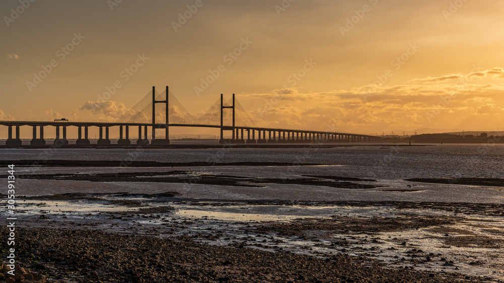 Golden Hour at the The Prince of Wales Bridge and the River Severn, seen from Redwick, South Gloucestershire, England, UK
