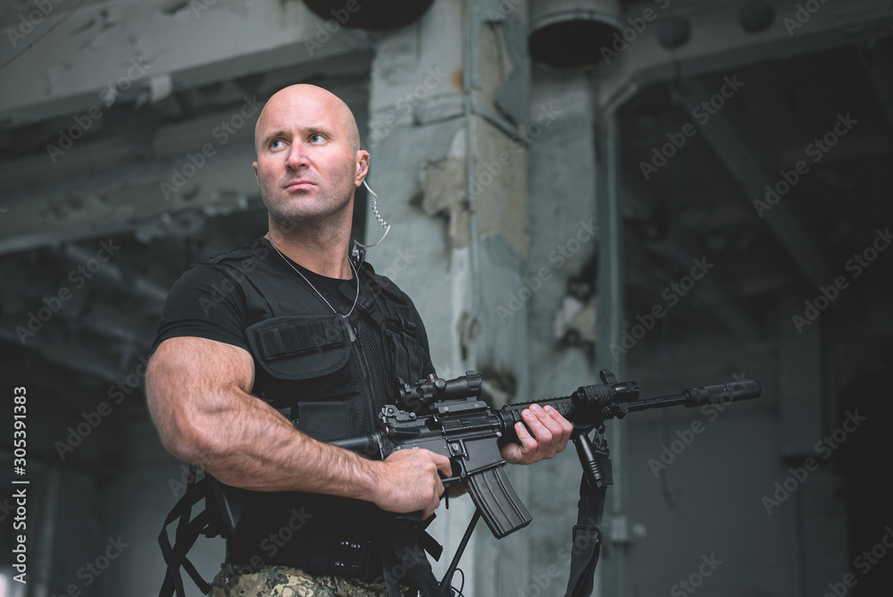 Concept photo of special agent man with a rifle. Person with airsoft gun. Thriller film concept. Concept photo of special agent man with a rifle. Person with airsoft gun. Thriller film concept.