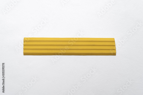 Yellow seal for doors, windows, parts, appliances and plumbing on a white background photo