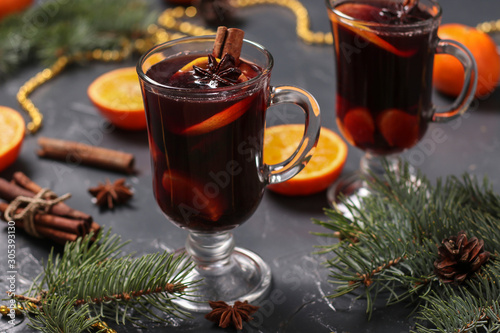 Christmas mulled wine and tangerines on a dark background, horizontal orientation