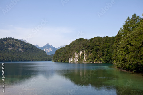 summer horizontal landscape with alpine lake, forest, mountains. Germany