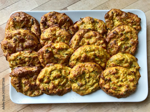 Mucver / Traditional Turkish, Greek Zucchini Meal Dish with Curry and Dill in Plate. photo