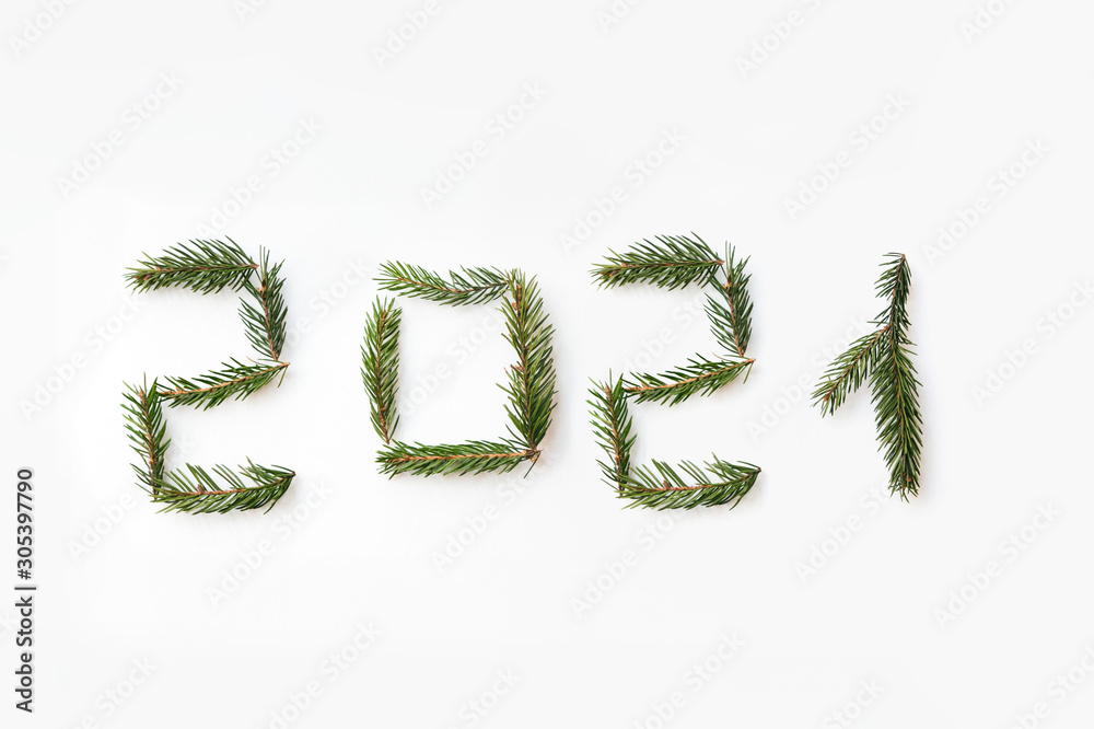 Number of new year 2021 made of fir branches. Flat lay, top view Number of new year 2021 made of fir branches. Flat lay, top view