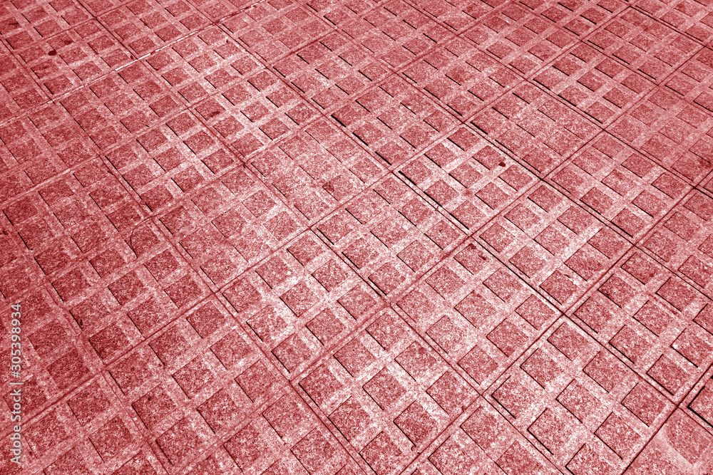 Fototapeta premium Stone pavement texture with blur effect in red tone.
