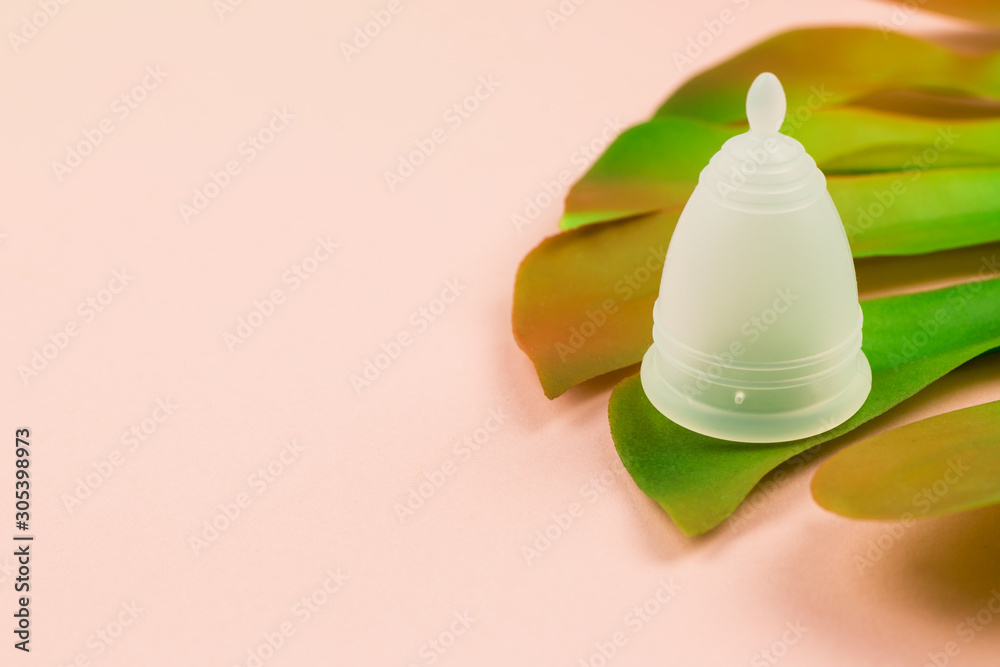 Close up of menstrual cup on pink background