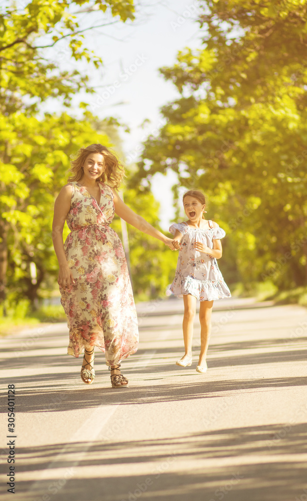 Obraz premium Mother and daughter in nature.