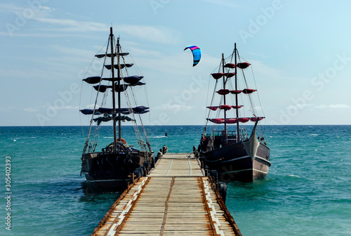 lone kiteboarder and two boats for excursions, the season is over