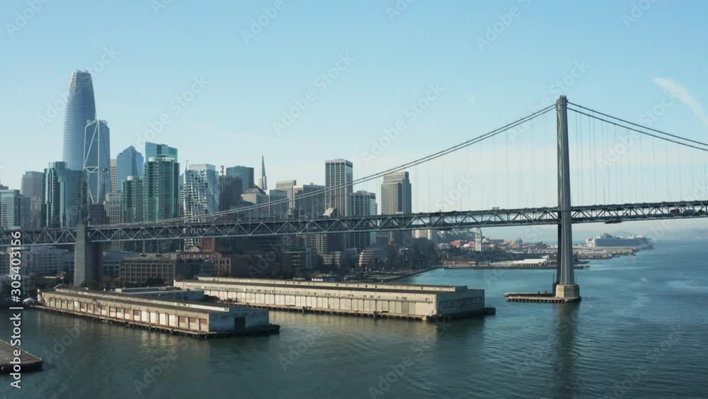 Aerial of Bay Bridge with Skyline in Background San Francisco Blue Day, Wide Shot Tracking, California Aerial of Bay Bridge with Skyline in Background San Francisco Blue Day, Wide Shot Tracking, California