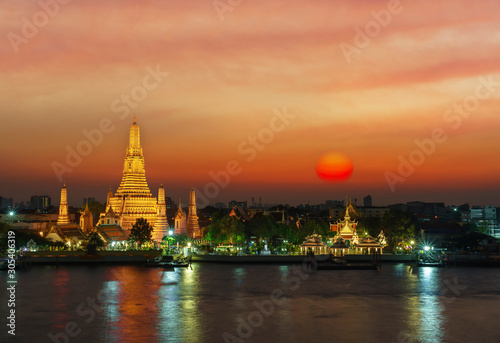 Wat Arun Ratchawararam Ratchawaramahawihan or  Wat Arun meaning Temple of Dawn on Chao Phraya River at sunset , Bangkok , Thailand © PK4289