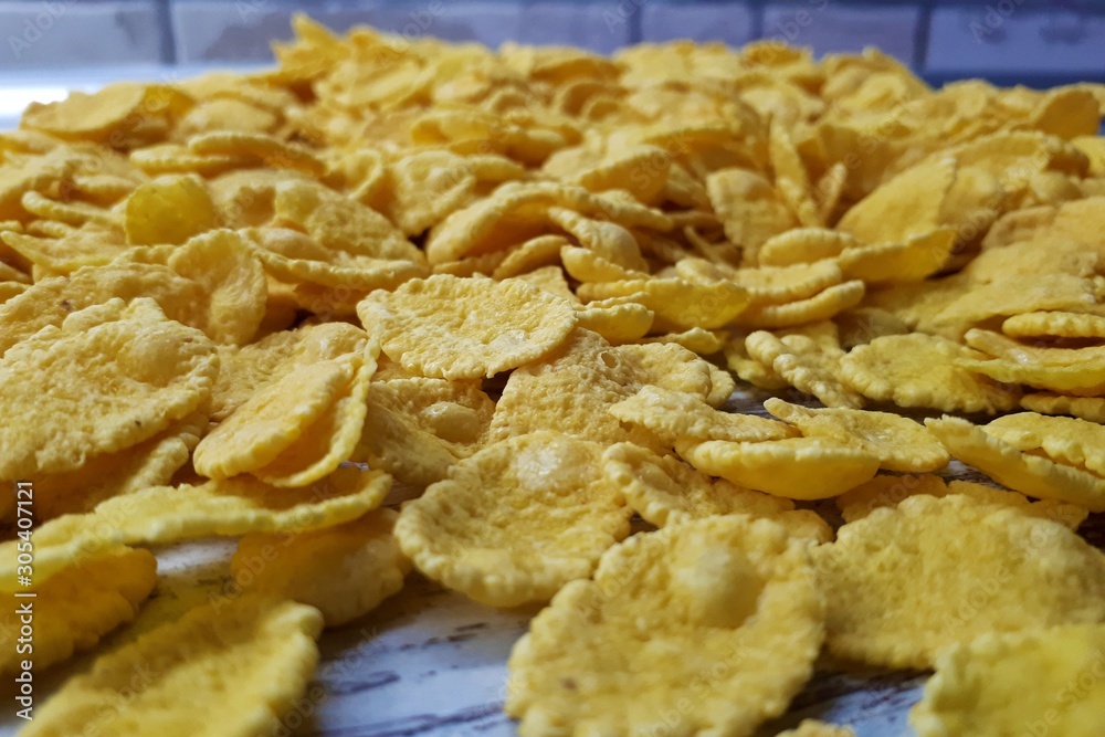 closeup of sprinkled tasty wholesome breakfast cereal on a wooden surface closeup of sprinkled tasty wholesome breakfast cereal on a wooden surface