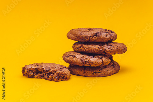 Chocolate cookies with yellow background