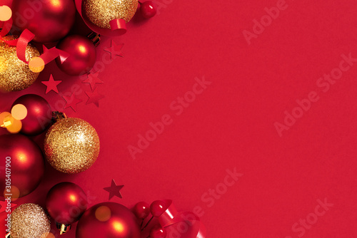 Christmas or New Year Festive red background with Christmas balls and lights