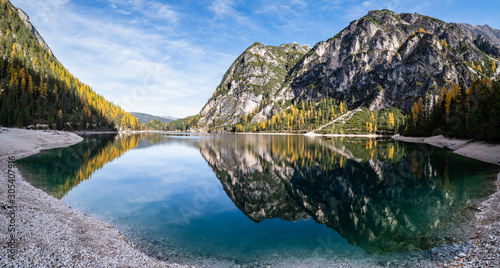 Fototapeta Naklejka Na Ścianę i Meble -  Autumn peaceful alpine lake Braies or Pragser Wildsee. Fanes-Sennes-Prags national park, South Tyrol, Dolomites Alps, Italy, Europe. Picturesque traveling, seasonal and nature beauty concept scene.