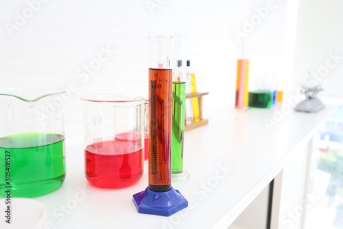 laboratory glassware with liquids of colors