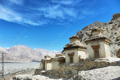 Buddhist stupas and himalayan mountains from Diskit gompa, Nubra valley, Ladakh, India
