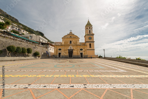 A view across the Piazza San Gennaro in in the little town, in Southern Italy Praiano, on the Amalfi coast. Church of San Luca Evangelista, Praiano, Province of Salerno, Campania, Italy.