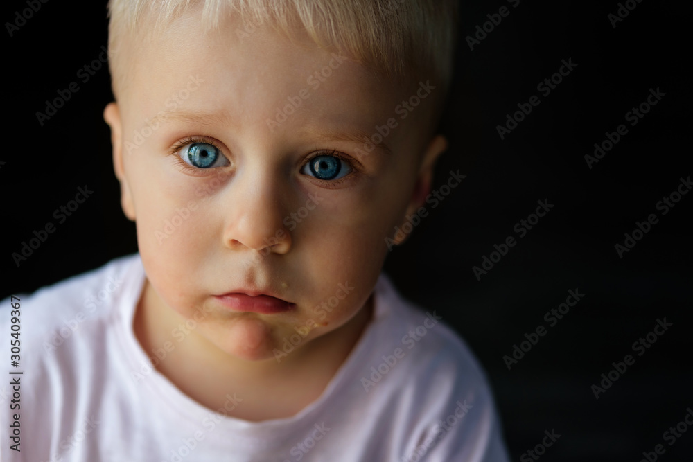 Portrait of a little blond boy with blue eyes Portrait of a little blond boy with blue eyes