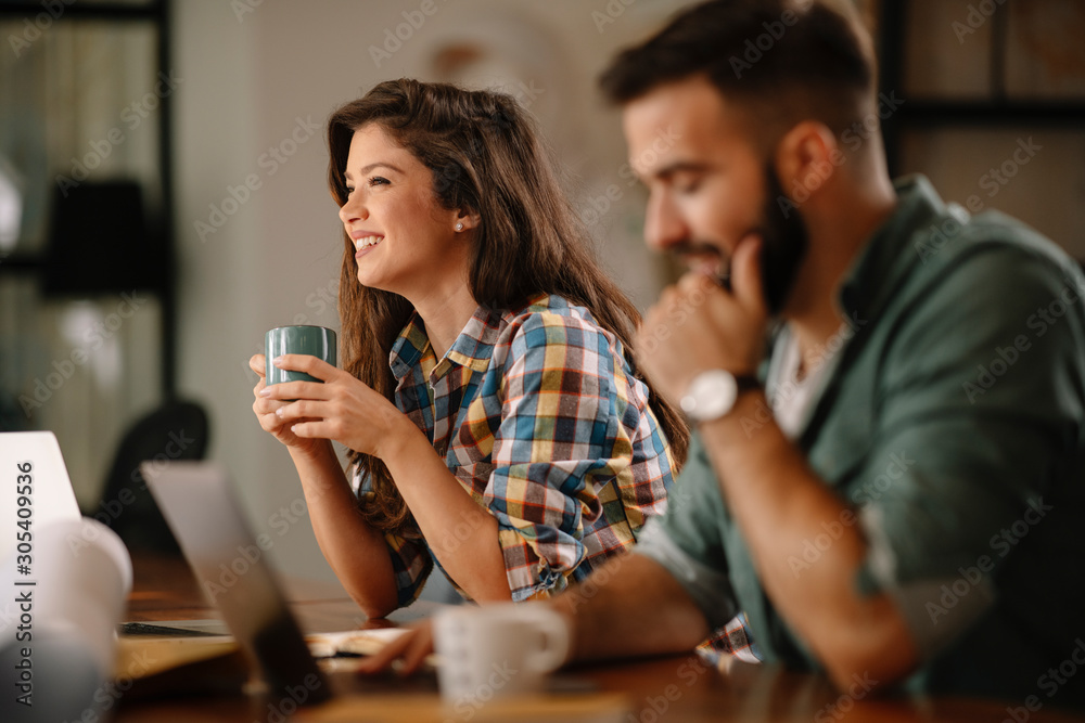 Colleagues in office. Businesswoman and businessman discussing work in office. Two friends in working together. Colleagues in office. Businesswoman and businessman discussing work in office. Two friends in working together.