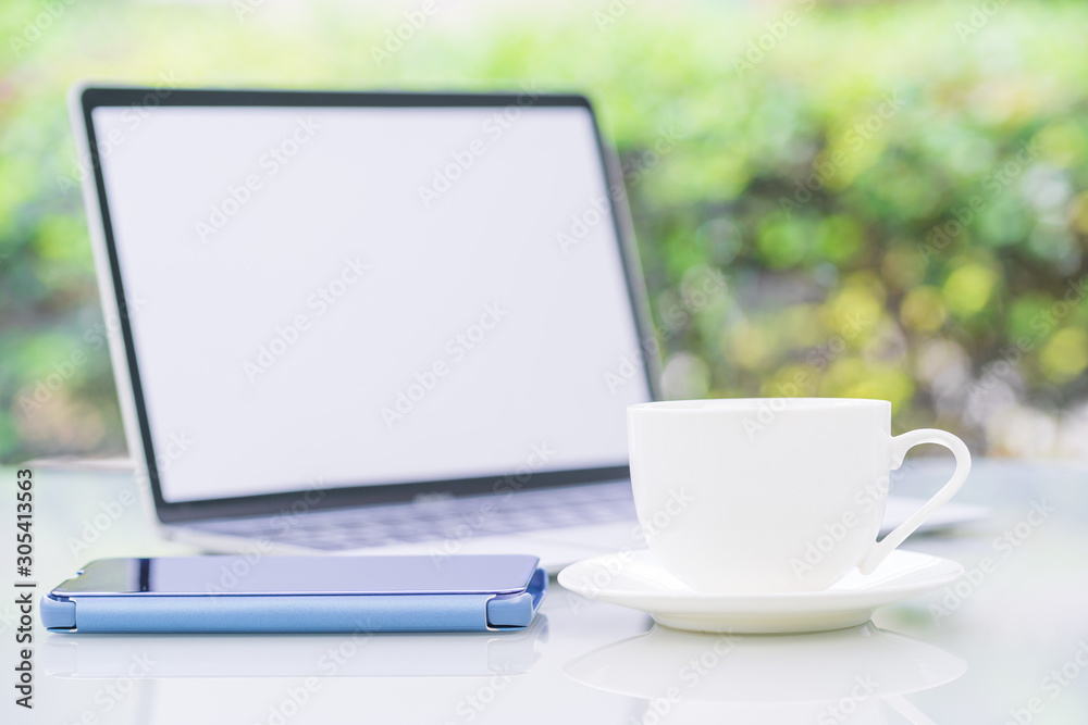 Coffee cup and laptop at office with smartphone Coffee cup and laptop at office with smartphone