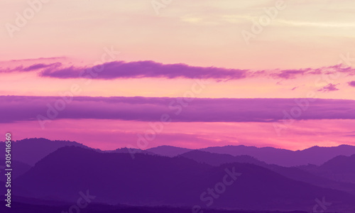 Beautiful landscape mountain range and purple sky at the sunset, twilight period which including of sunrise  © minicase