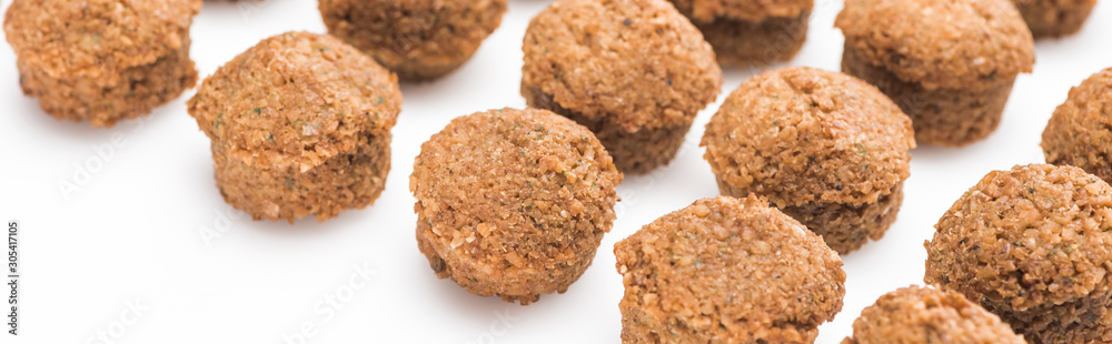 close up view of delicious fresh cooked falafel balls on white background, panoramic shot close up view of delicious fresh cooked falafel balls on white background, panoramic shot
